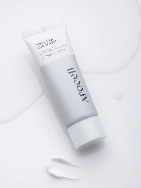 Осветляющий солнцезащитный флюид с транексамовой кислотой Arocell Mela TXA Sun Serum SPF50+ PA++++