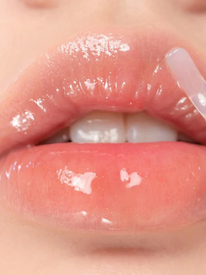 Жидкий блеск для губ с сияющими частицами в кораловом оттенке rom&nd Glasting Water Gloss 01 Sanho Crush